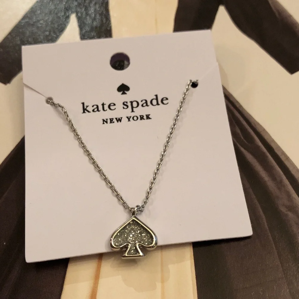 Authentic New on card. kate spade silver-tone glitter spade pendant necklace.